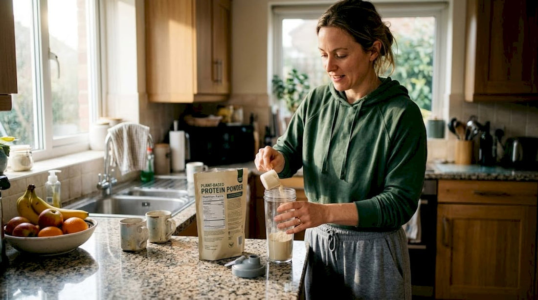 Woman making protein shake in her kitchen