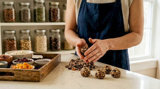 Hands rolling vegan protein energy balls