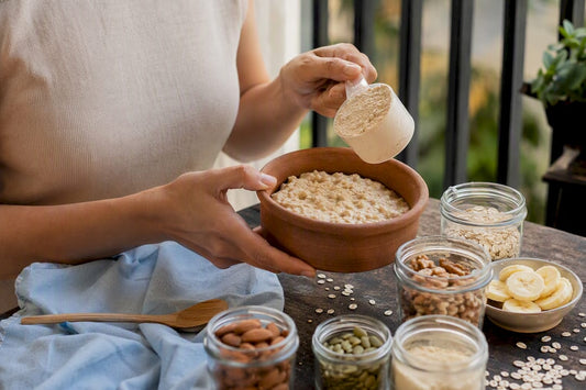 Hands preparing high-protein oatmeal bowl