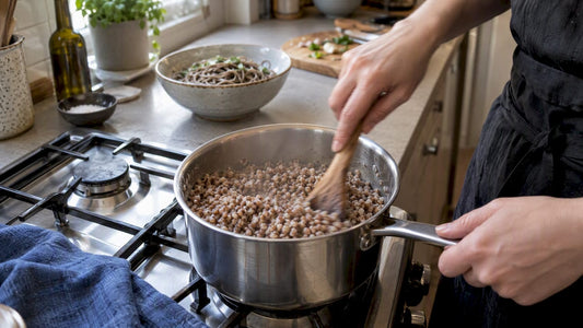 Buckwheat porridge cooking beside a bowl of soba